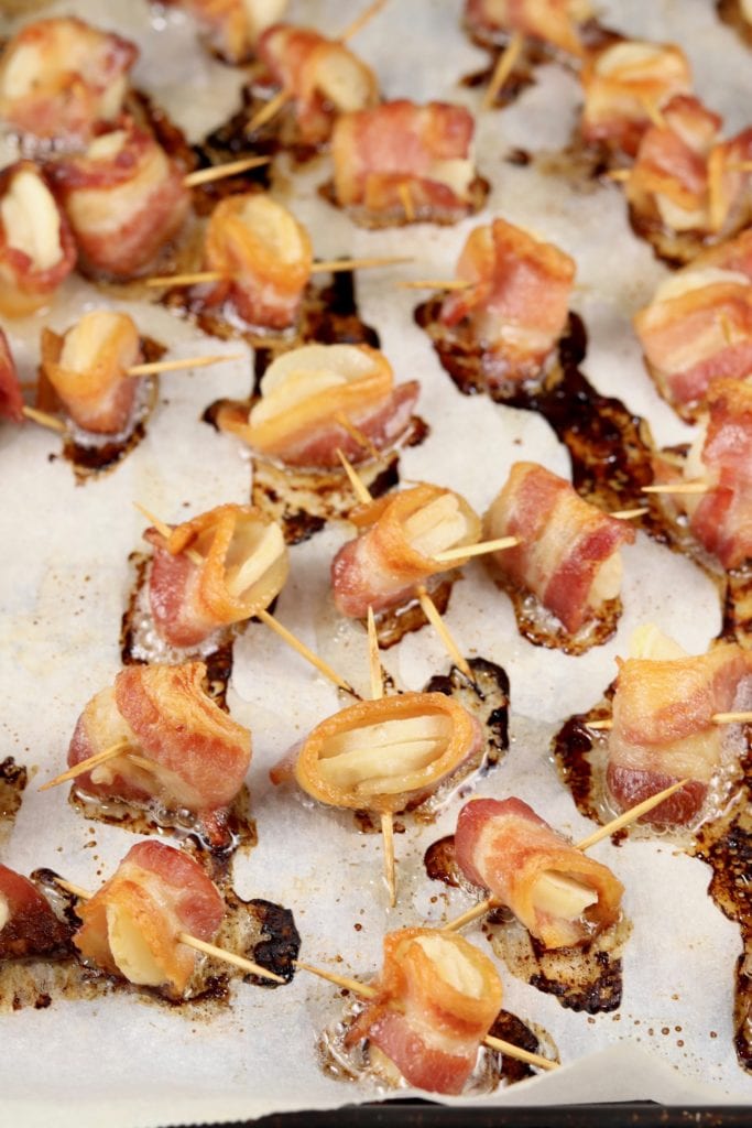baked bacon appetizers on a baking sheet