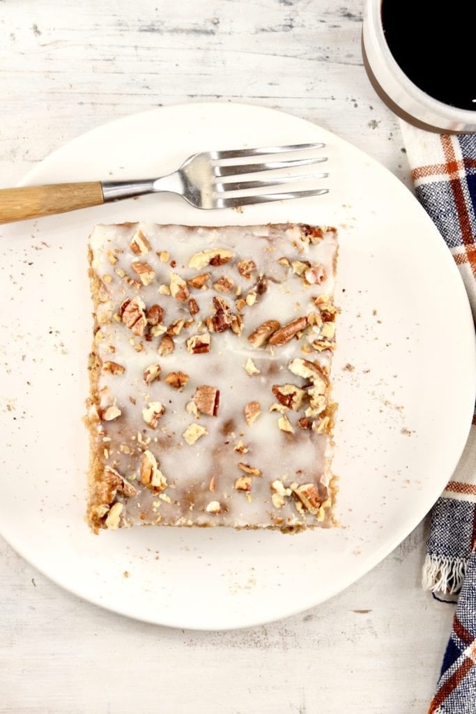 Slice of sheet cake with pecans