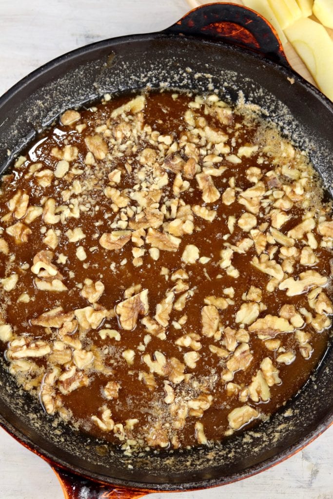 Caramelized sugar and walnuts in a skillet