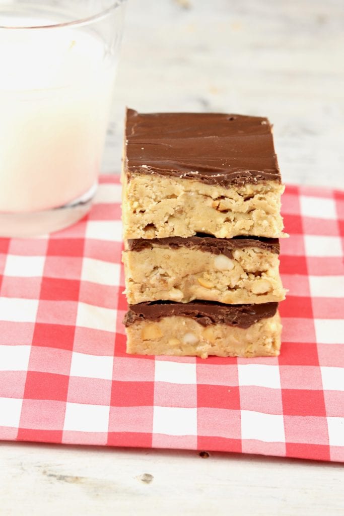 Stack of Peanut Butter bars with glass of milk