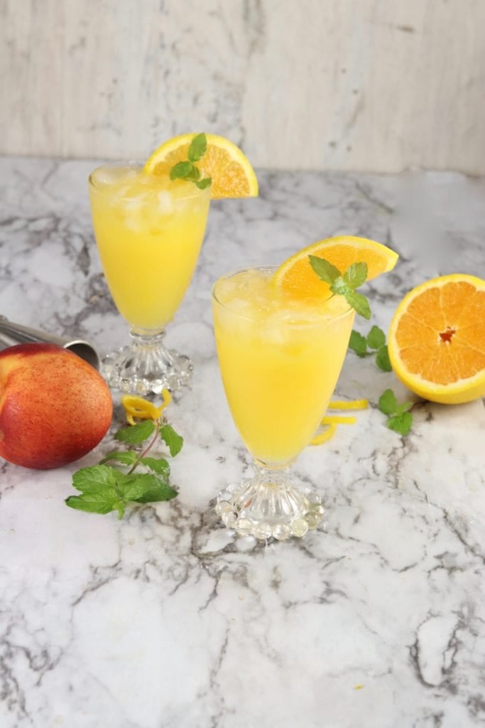 Fuzzy Navel with mint and orange garnishFuzzy Navel cocktails are a classic party drink that we just can't get enough of! With just two ingredients, it's one of the easiest drinks you can make for parties!