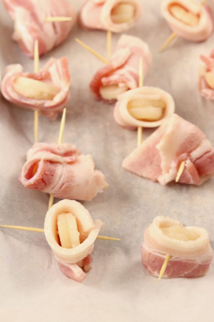 Water chestnuts wrapped in bacon and secured with a toothpick