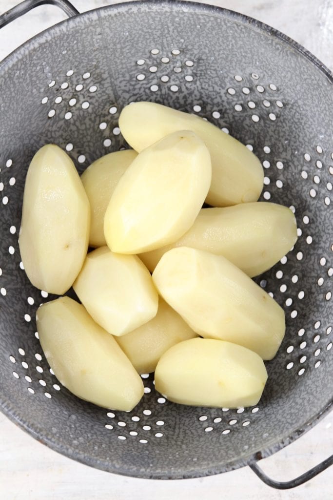 Peeled potatoes in a calender