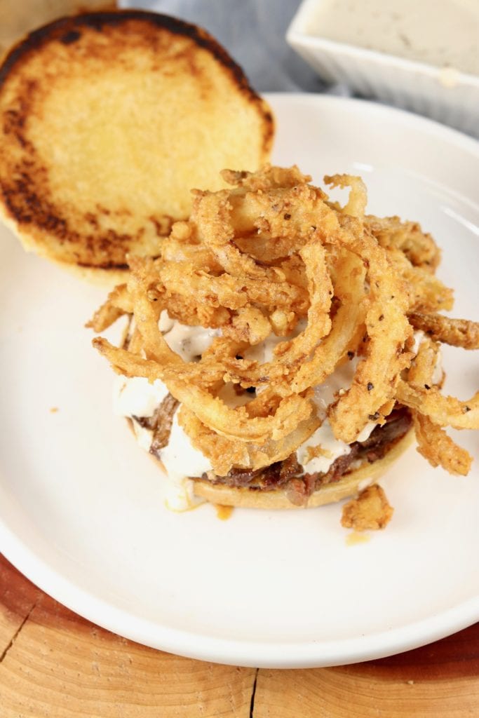 Toasted bun and roast sandwich with fried onions