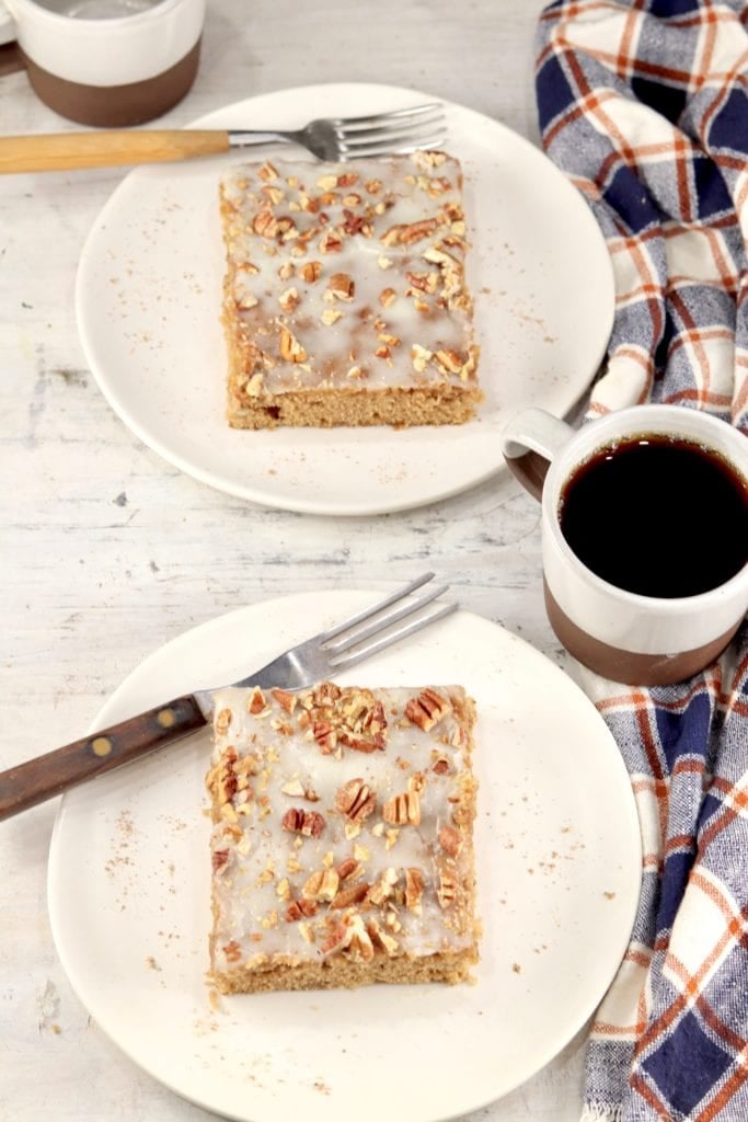 2 slices of pecan sheet cake with coffee