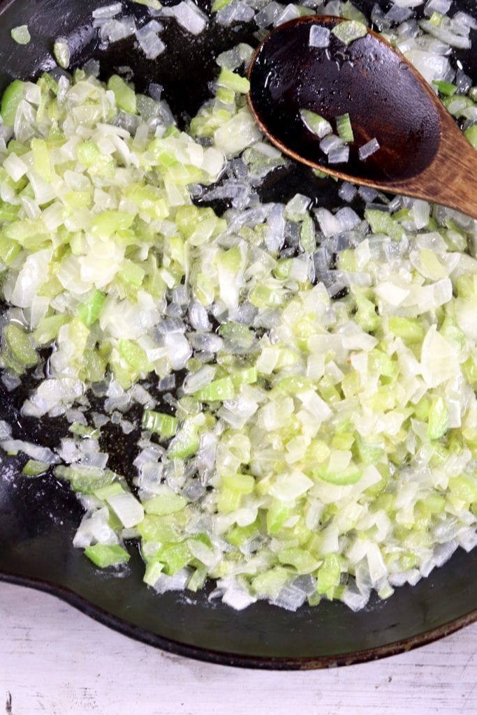 Cooked chopped onions and celery in a skillet