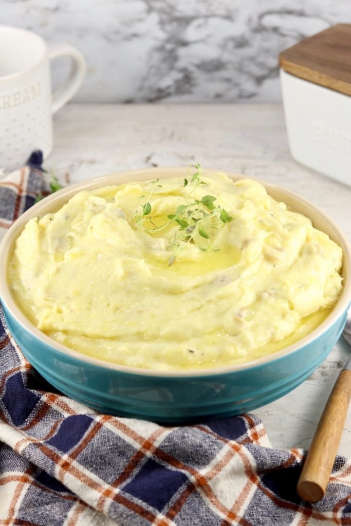 Mashed Potatoes for holiday dinners with butter drizzled on top