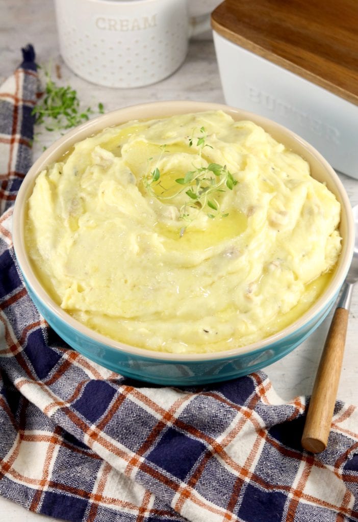 Creamy Mashed Potatoes in a bowl with a plaid napkin