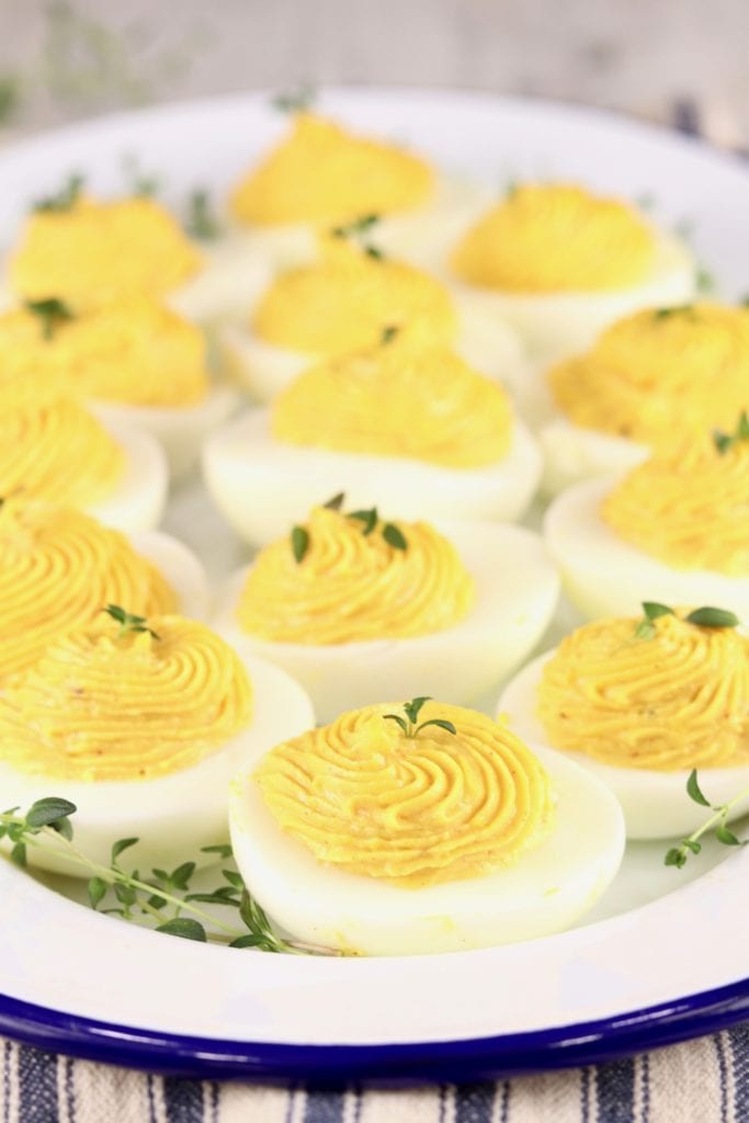 Deviled Eggs garnished with herbs