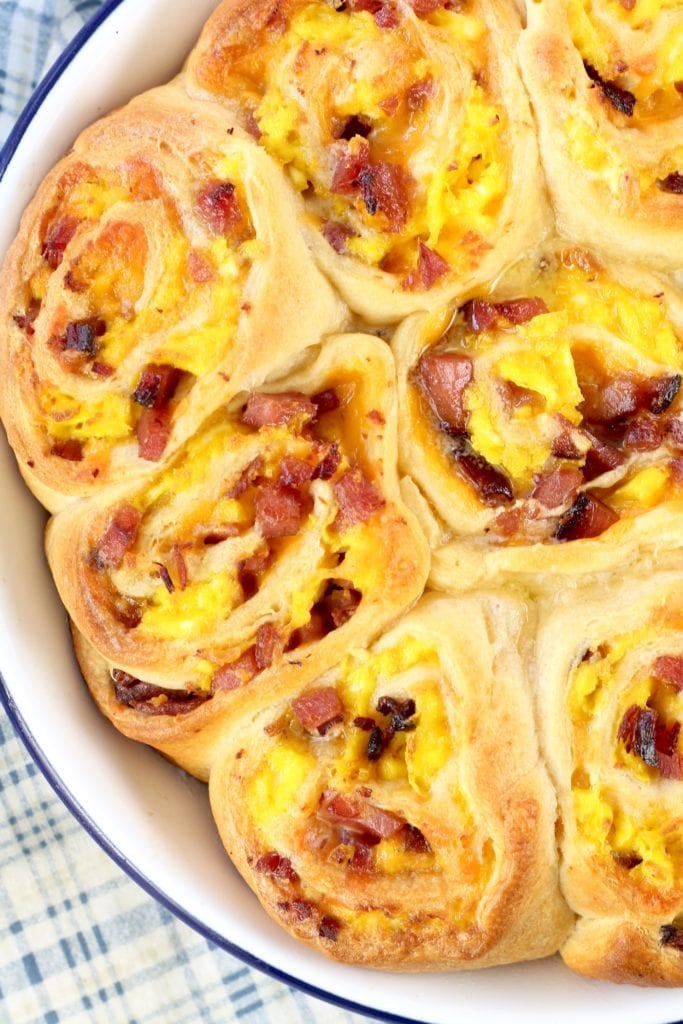 Close up of pan of breakfast rolls with ham, eggs and cheese