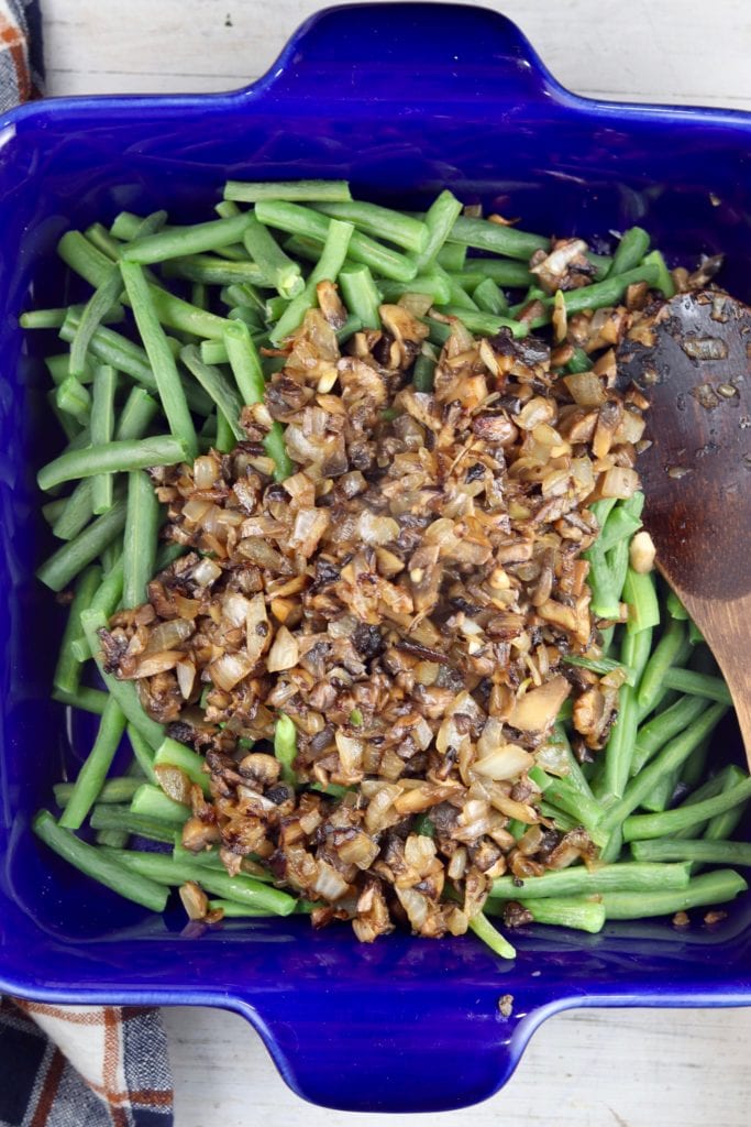 Green beans, mushrooms and onions in a blue casserole dish