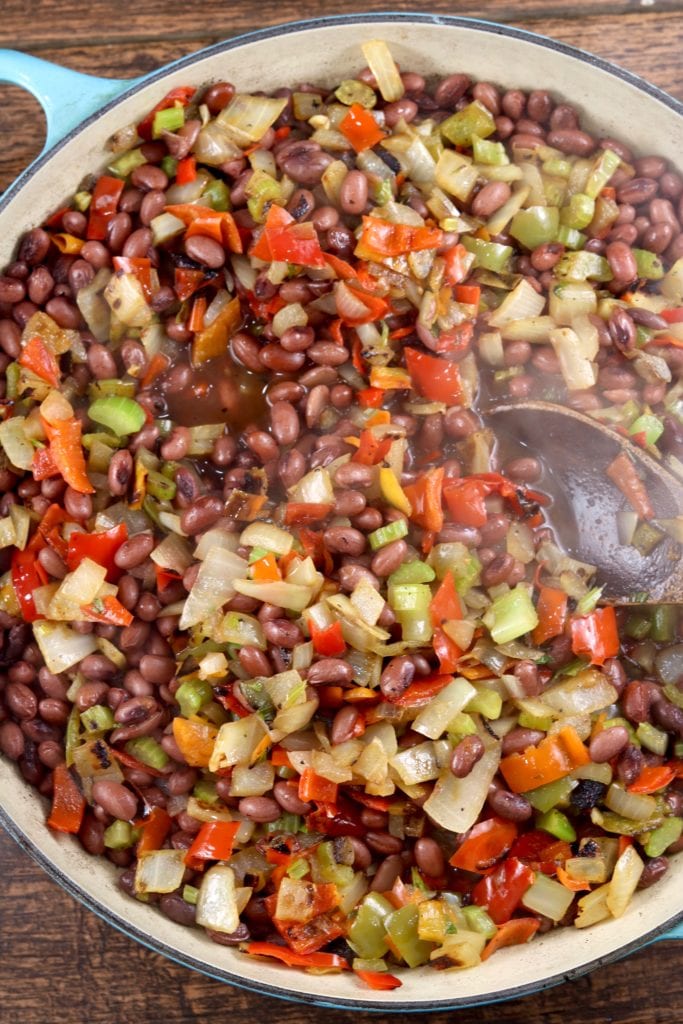 Pan of red beans and rice with peppers and onions