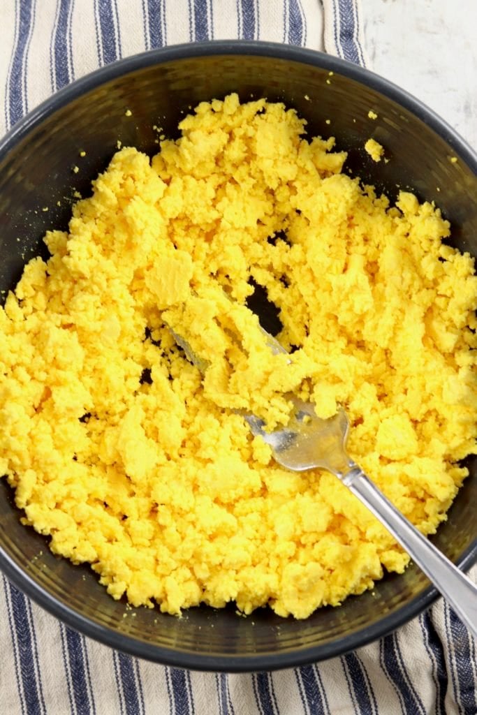 Egg Yolks in a bowl smashed with a fork