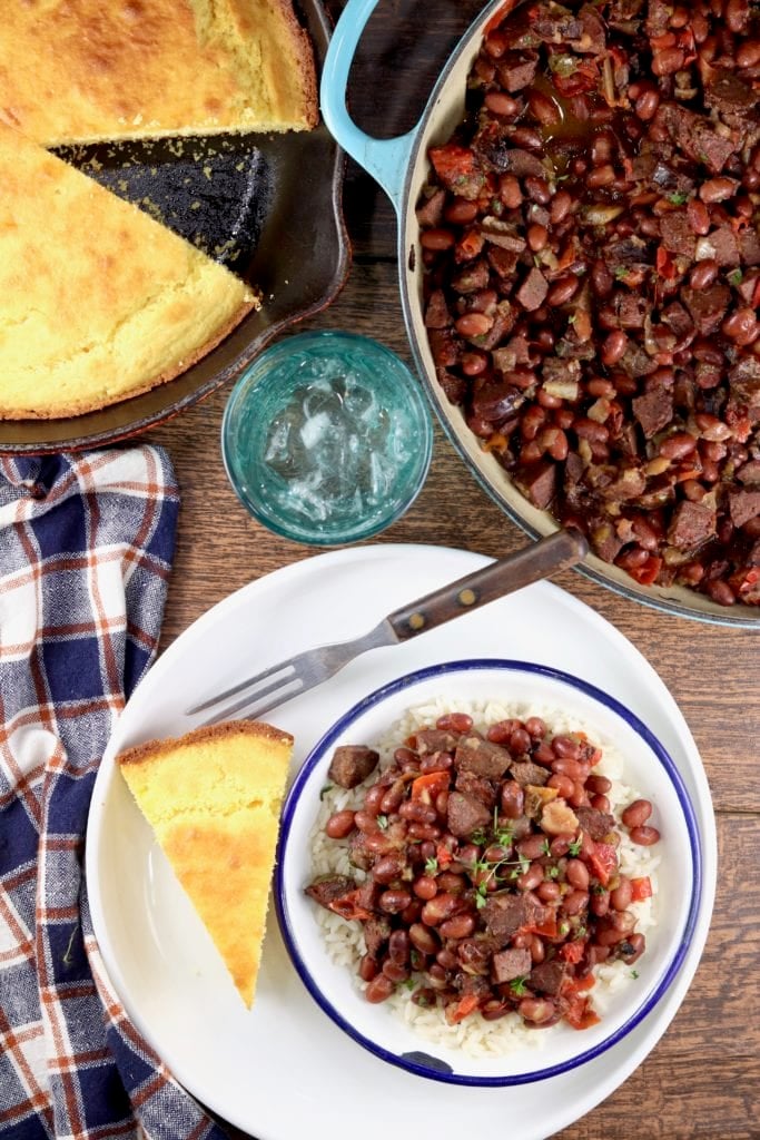 Pot of red beans and rice and bowl with cornbread
