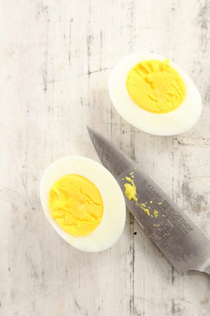 Boiled Egg cut in half with a knife