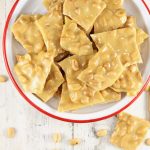 Peanut Brittle in a red rimmed bowl