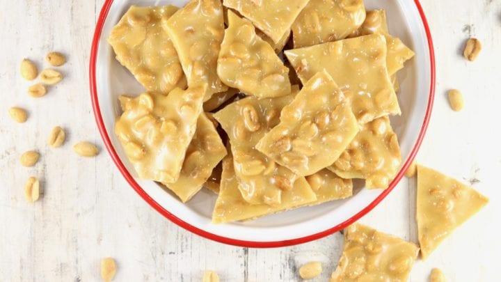 Peanut Brittle in a red rimmed bowl