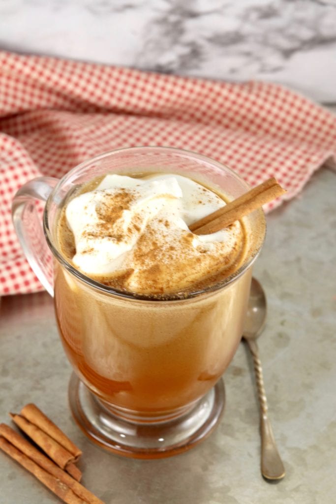 Hot Buttered Rum with whipped cream and cinnamon