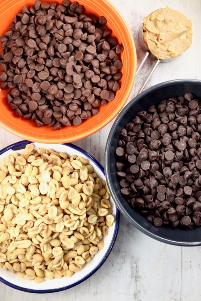 Chocolate chips, peanuts and peanut butter for peanut clusters