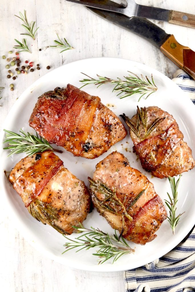 Grilled bacon wrapped maple and rosemary glazed pork chops