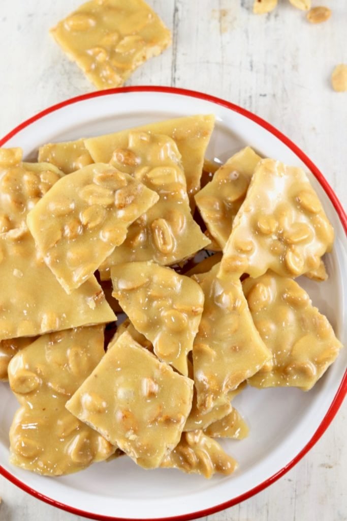 Peanut Brittle on a red rimmed plate