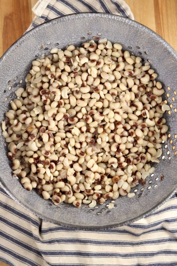 Sorted purple hull peas in a colander