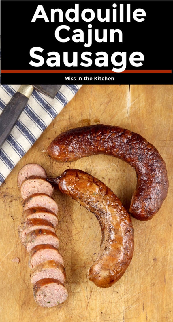 Andouille Cajun Sausage sliced and whole links on a cutting board