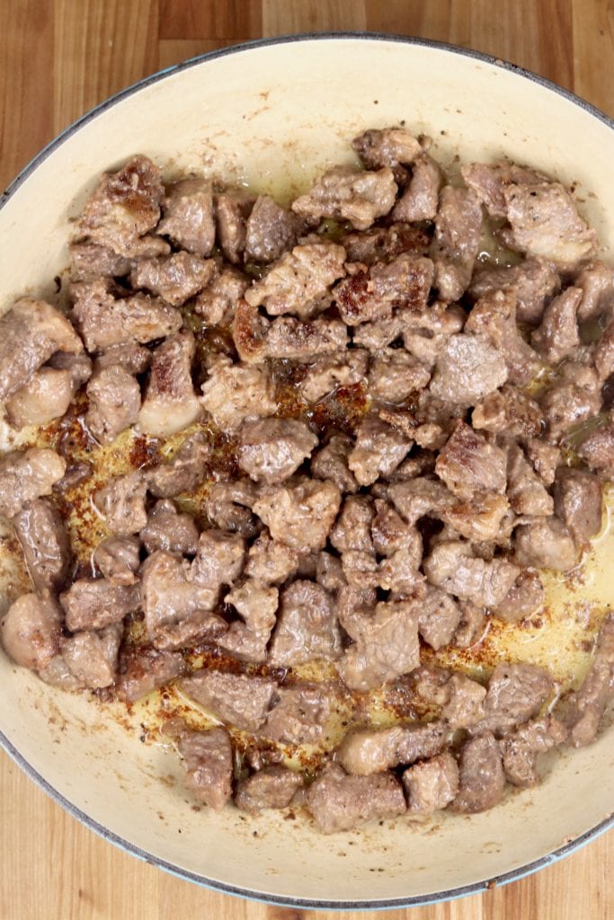 Browned stew meat in a dutch oven