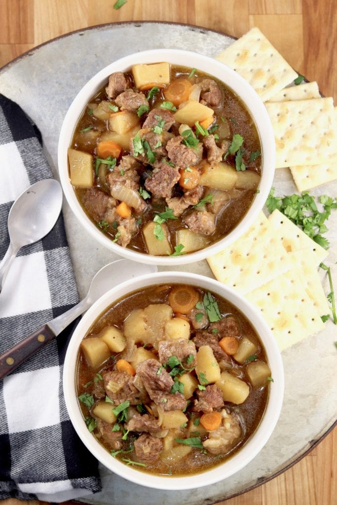 2 bowls of beef stew with crackers