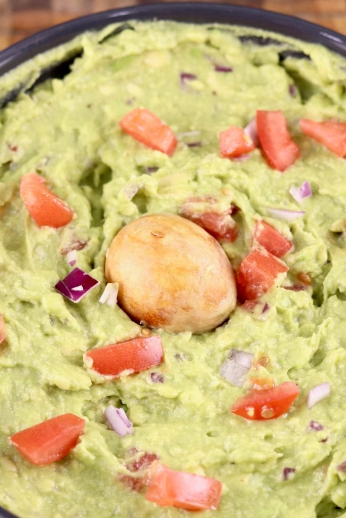 Guacamole with avocado seed in center 