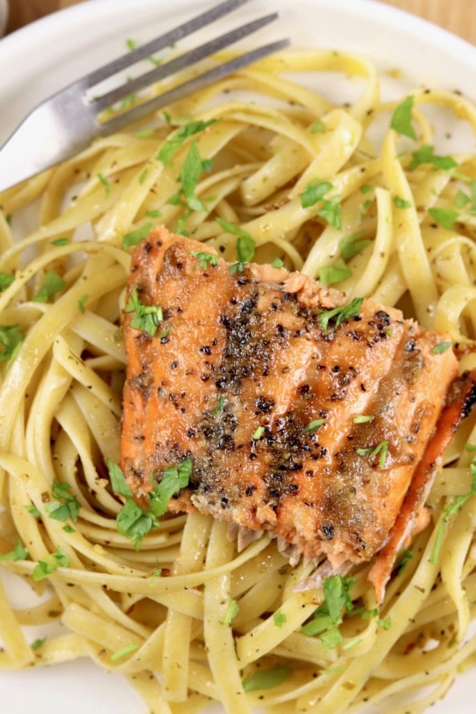 Grilled salmon filet over pasta