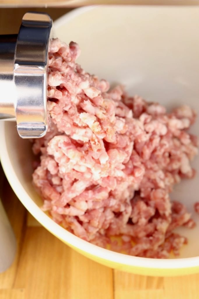 How to make homemade Cajun sausage Grinding pork with a meat grinder