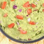 Guacamole dip with tomatoes