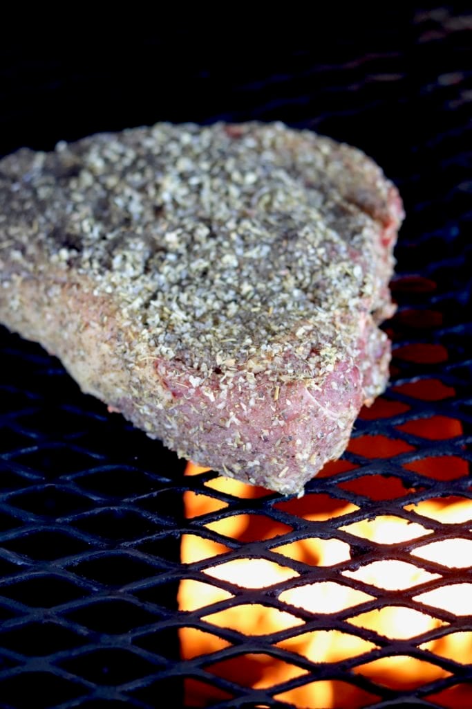 Roast on a grill with herb rub