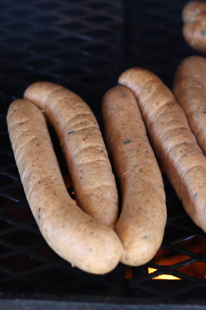 smoking andouille sausage links on a grill