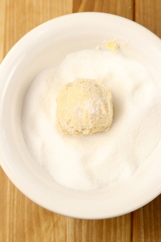 Rolling cookie dough in sugar