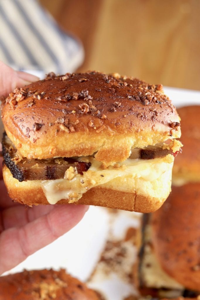 Close up of a brisket slider with melted Swiss