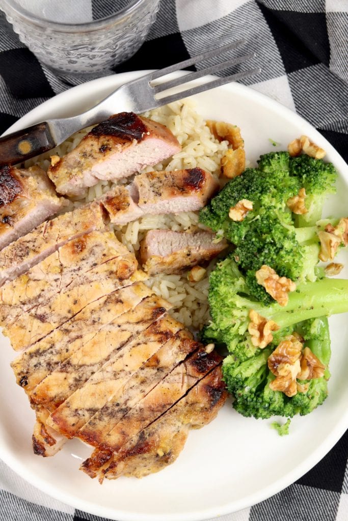 Pork chop on a plate with broccoli