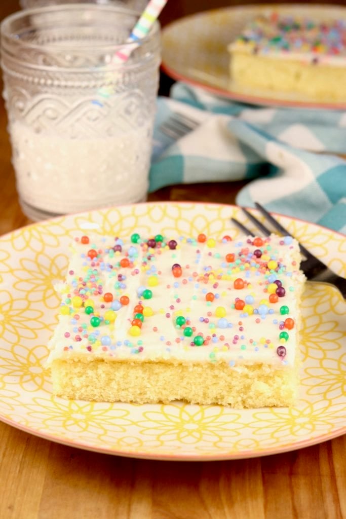 Slice of buttermilk sheet cake with sprinkles