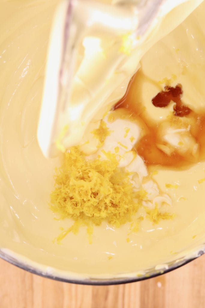 Making cheesecake batter with lemon zest and vanilla extract