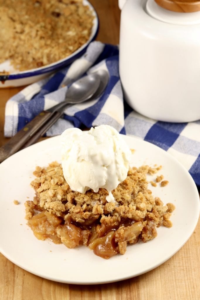 plate of apple crisp topped with ice cream