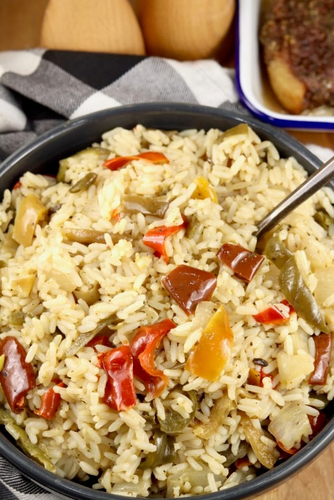 Bowl of rice pilaf with peppers and onions