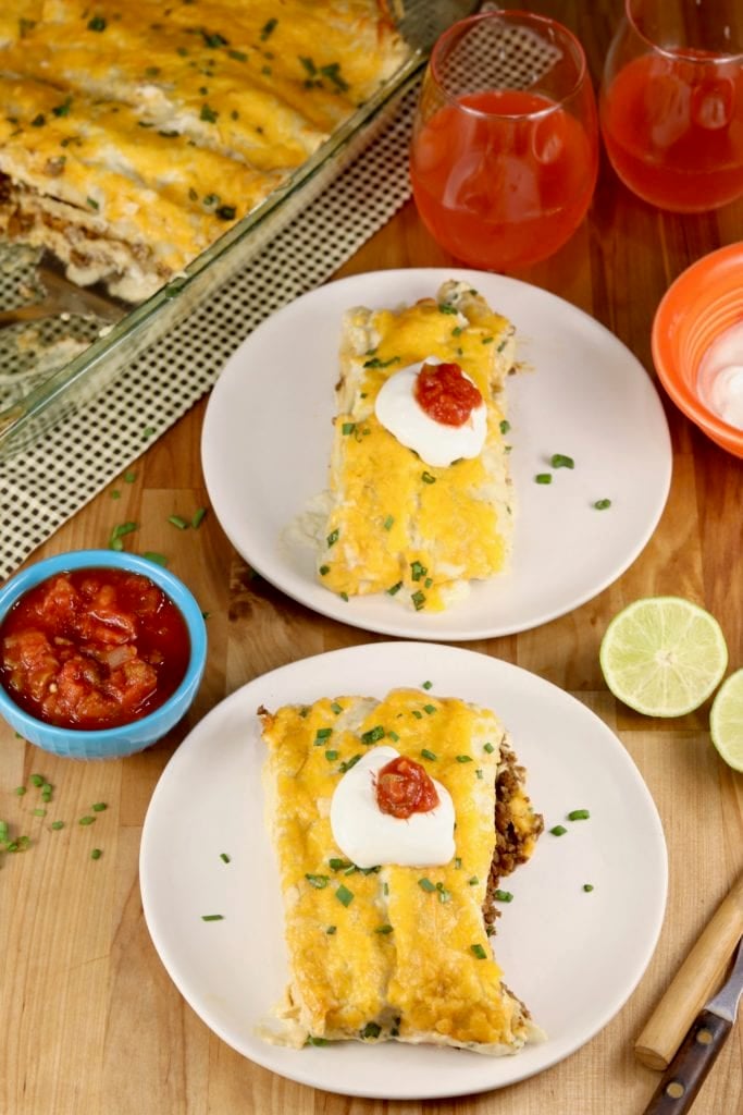 Smothered Burritos with sour cream and salsa