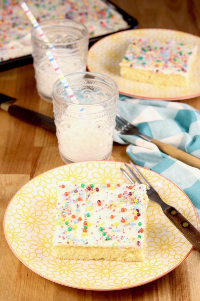 Sheet cake with sprinkles and glass of milk