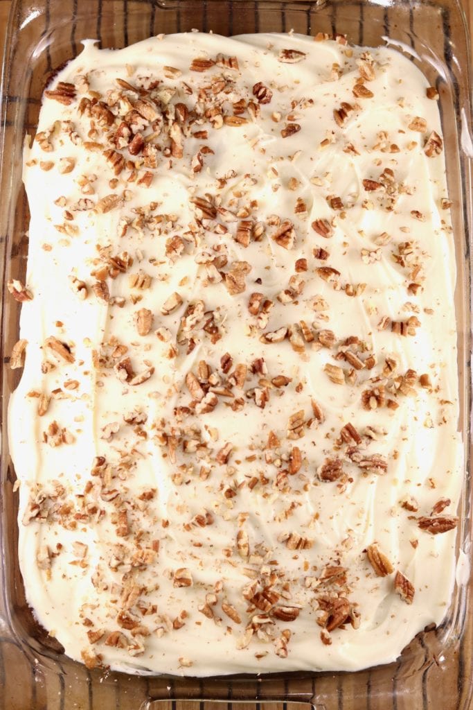 Cream Cheese frosted carrot cake topped with toasted pecans