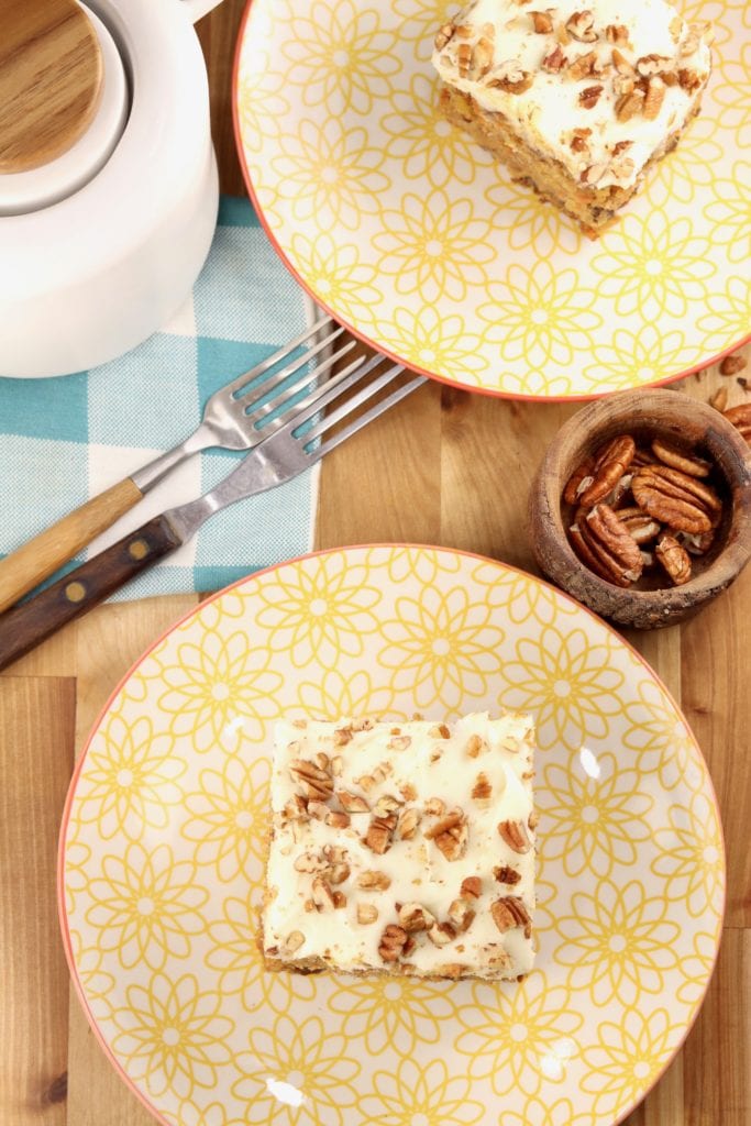 carrot cake with cream cheese frosting and pecans