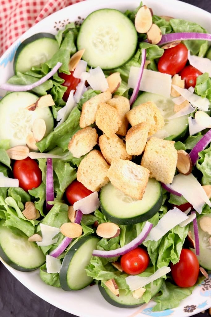 Green Salad with red onion, tomatoes and cucumbers
