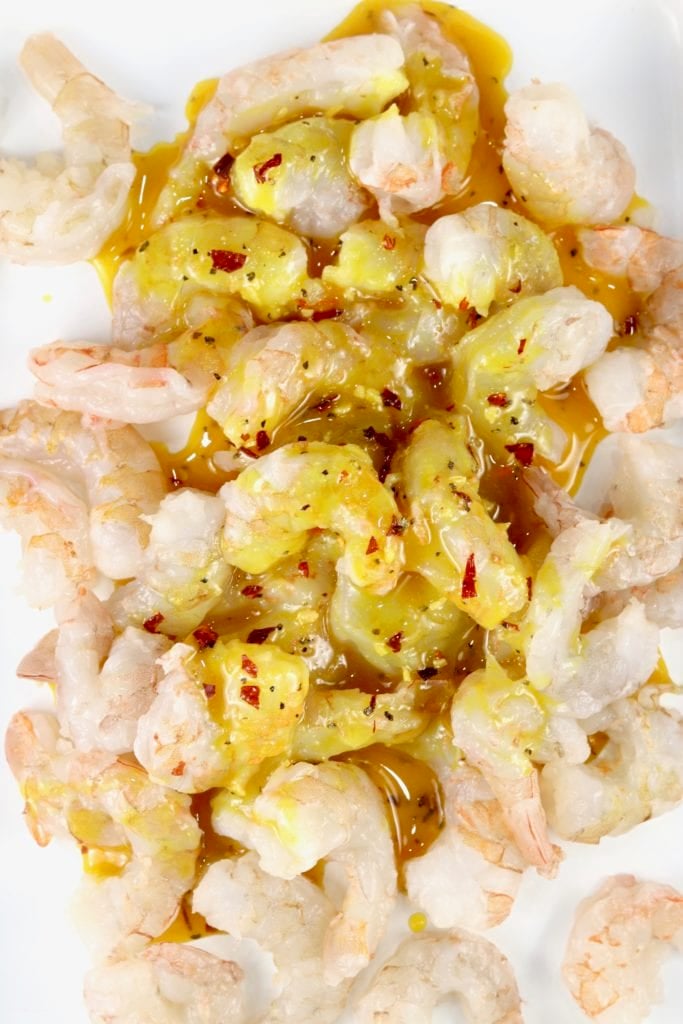 Cleaned and peeled large shrimp with honey mustard drizzled over the top.