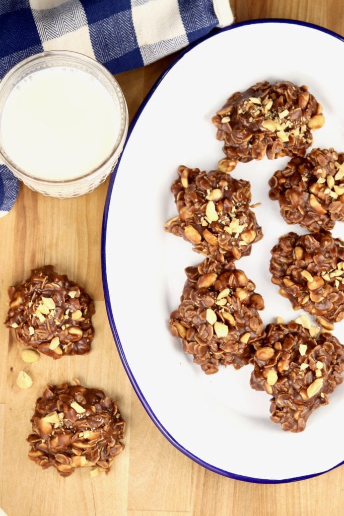 No bake cookies on a tray with a glass of milk