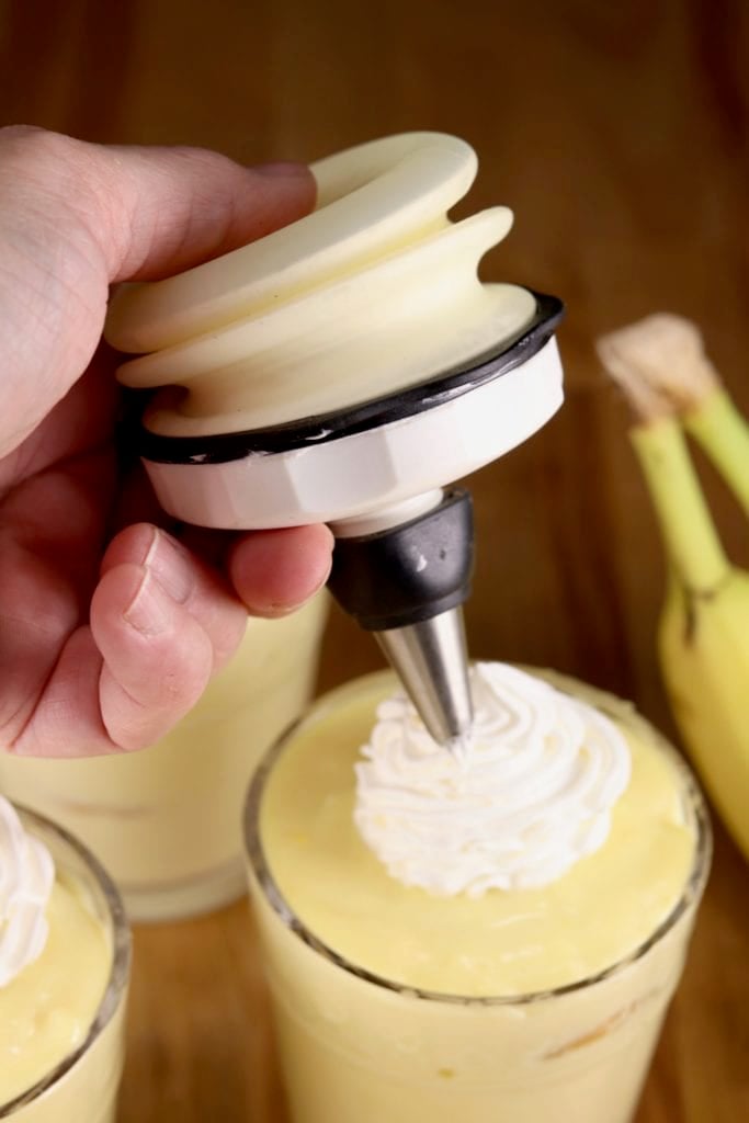 Topping banana pudding with whipped cream